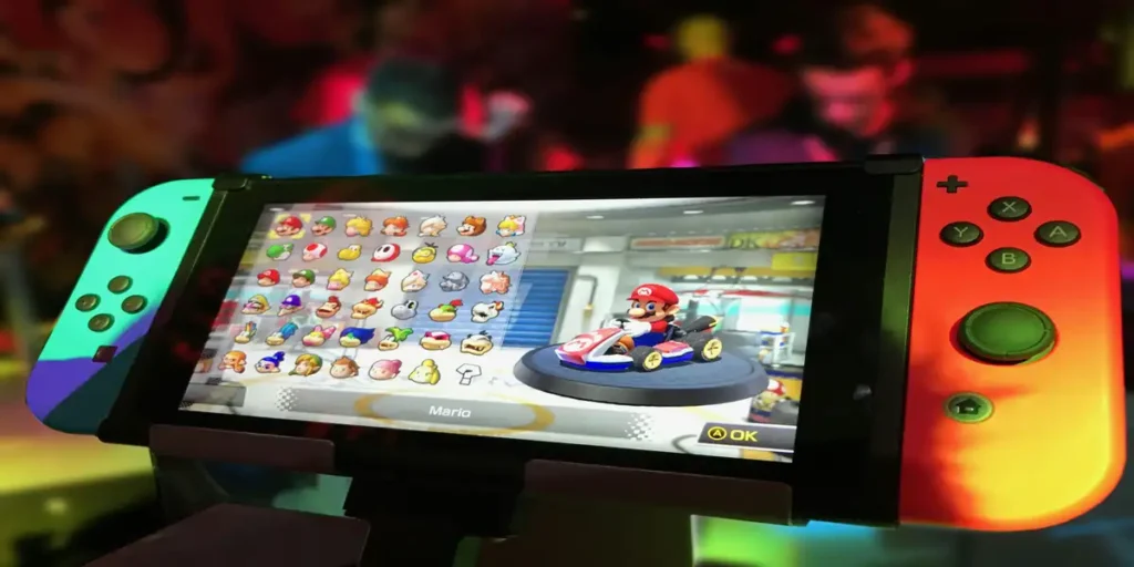 Close-up of a handheld gaming console displaying a colorful game character selection screen.