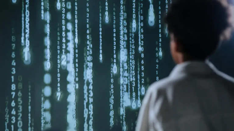 How Quantum Computing will reshape digital processing.Researcher analyzing a screen of cascading quantum data