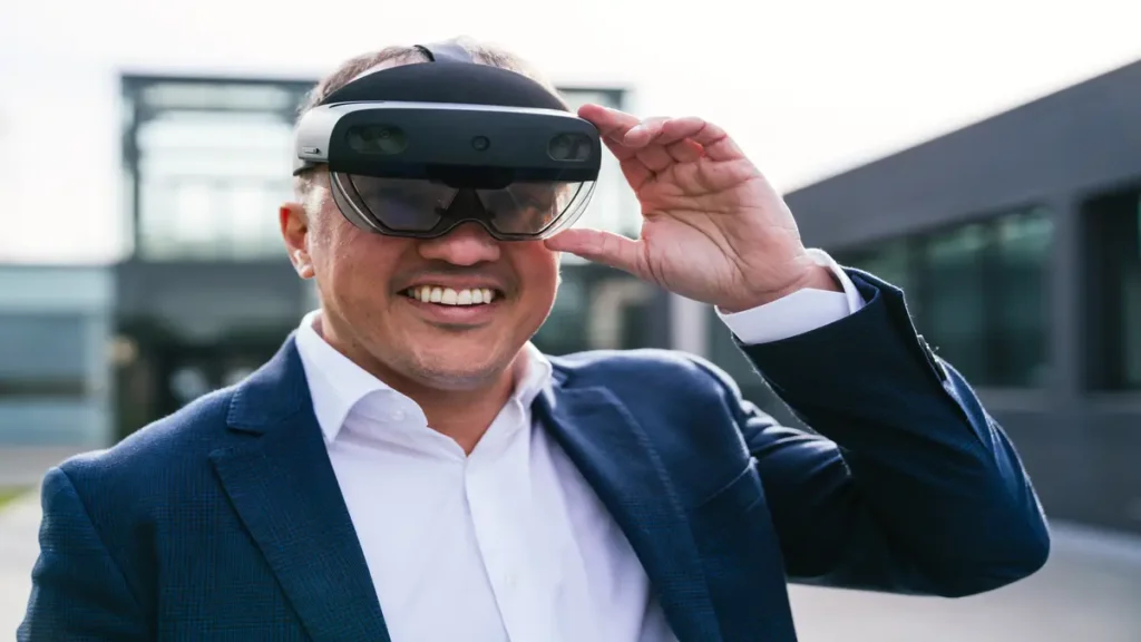 Businessman smiling while testing advanced smart glasses outdoors