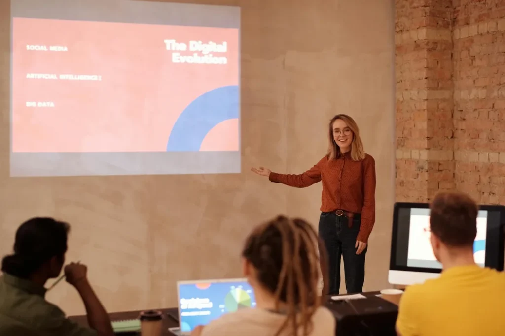 AI innovations - Woman presenting a slideshow titled “The Digital Evolution